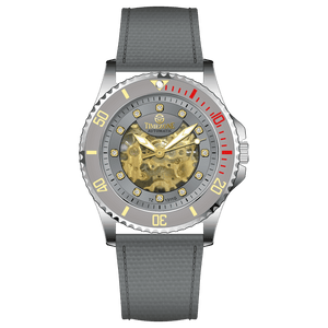 Branded wrist watch for men in pakistan. A silver-toned Monarch Luxe watch with a gray leather/cloth strap and a transparent dial showcasing the automatic movement.