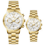 Branded couple wrist watches in pakistan. A pair of gold-toned watches with white analog dials, one large and one small, set against a black background.