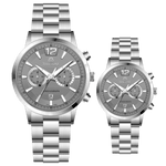 Branded couple wrist watches in pakistan. A pair of silver stainless steel watches with white dials and chronograph features.