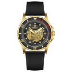 Branded wrist watch for men in pakistan. A gold-toned Monarch Prestige watch with a black leather band and a skeleton dial visible through the transparent case back.