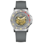 Branded wrist watch for men in pakistan. A silver-toned Monarch Luxe watch with a gray leather/cloth strap and a transparent dial showcasing the automatic movement.