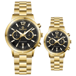 Branded couple wrist watches in pakistan. A pair of gold-toned watches with white analog dials, one large and one small, set against a black background.