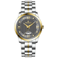 A stainless steel TimeZones watch with a silver dial, gold hands, and a stainless steel band. Discover timezone watches: elegant branded wrist watches for men in pakistan.
