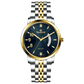 A Timezone watch with a stainless steel band and a silver dial featuring gold accents and markers. Discover timezone watches: elegant branded wrist watches for men in pakistan.
