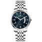 A silver TIMEZONE watch with a stainless steel band and dial surrounded by a silver case and a silver chain. Discover timezone watches: elegant branded wrist watches for men in pakistan.