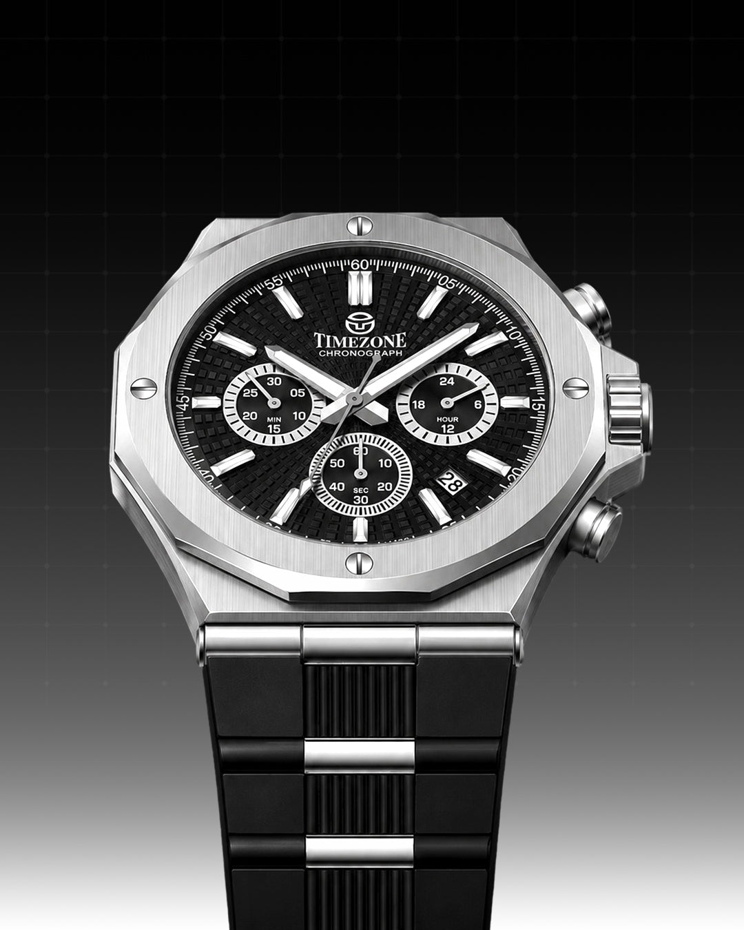 A Timezone analog chronograph watch with a brushed silver-tone octagonal case, black dial with white markings, and a black metal link bracelet, shown against a dark gradient background.